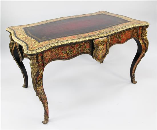 A Victorian style ebonised and ormolu mounted two drawer writing table, W.4ft 7.5in.